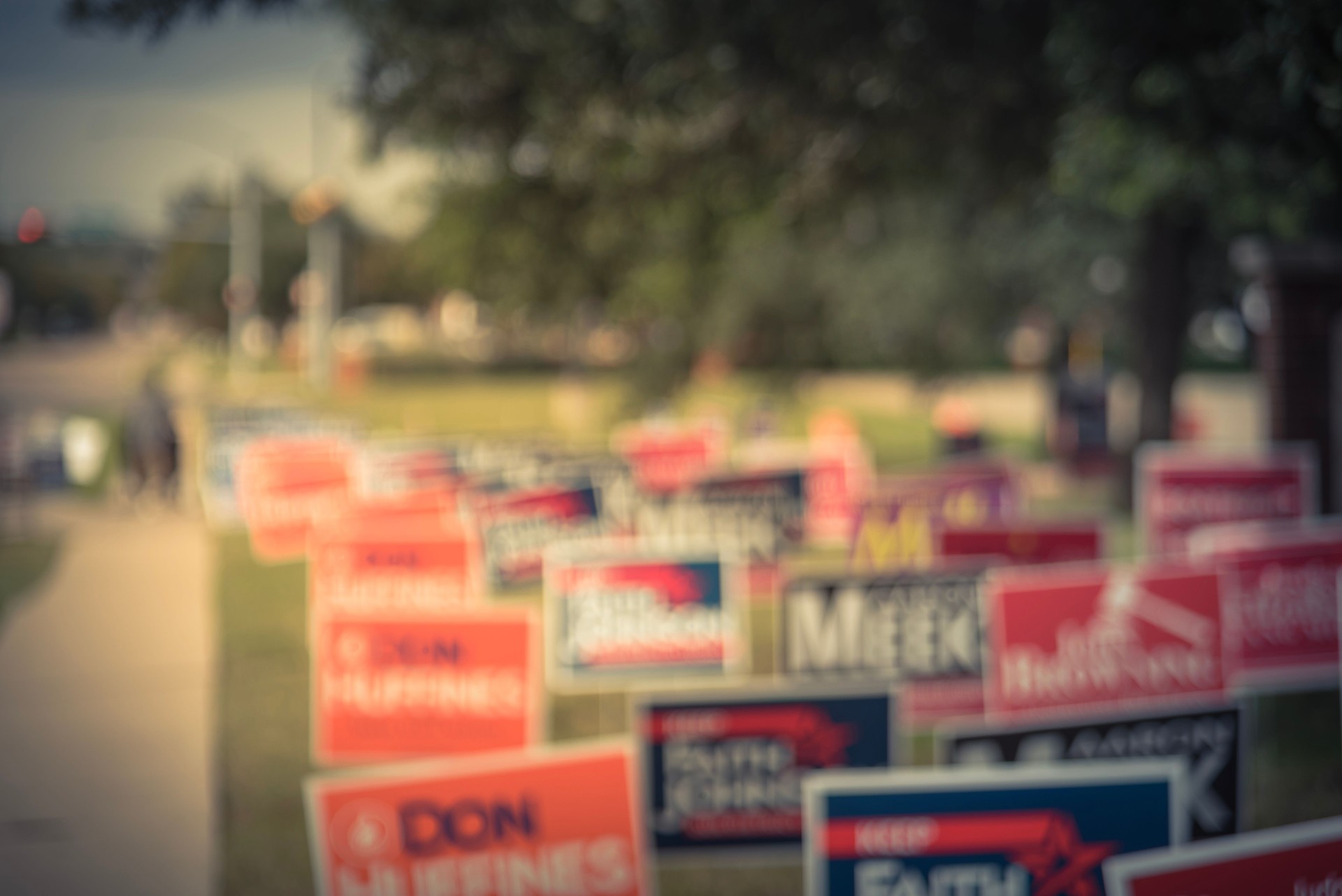 Filtered tone blurry background dense of yard signs for primary, midterm election in USA